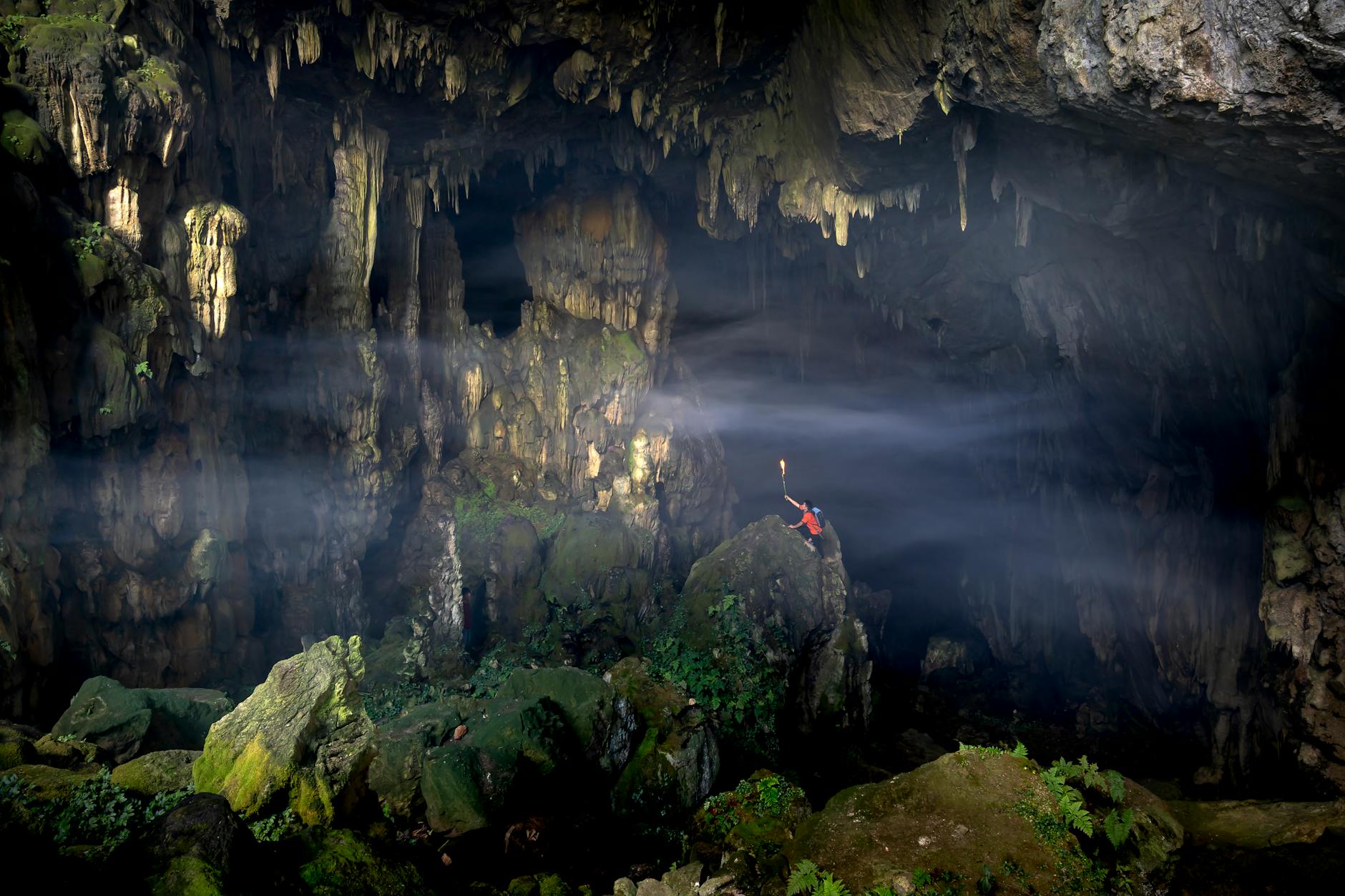 photo of a man alone in a cave